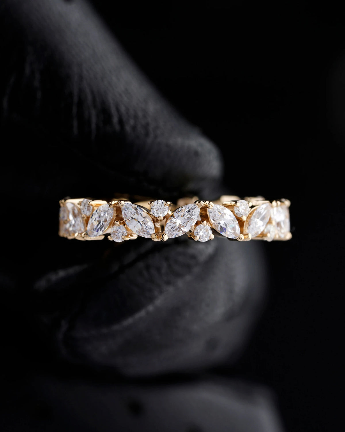 Stock photograph showing a fine gemstone band and its prong details