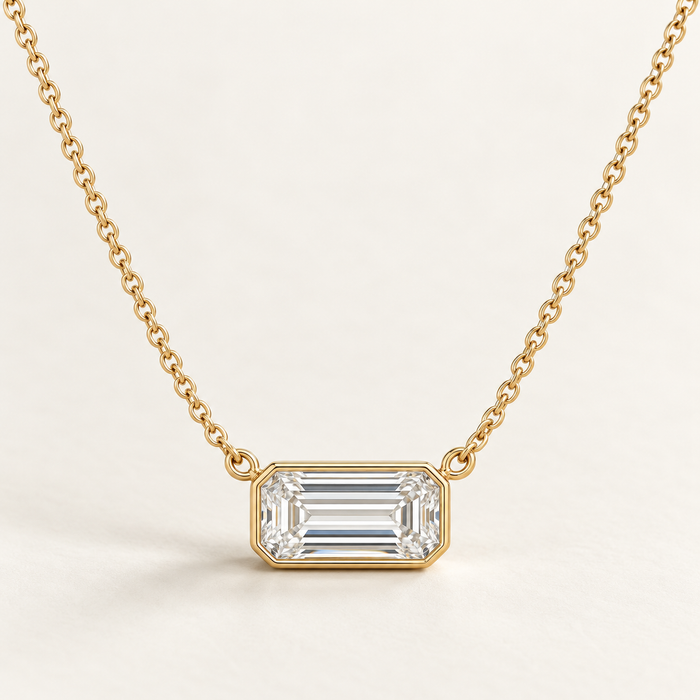 East-west emerald pendant